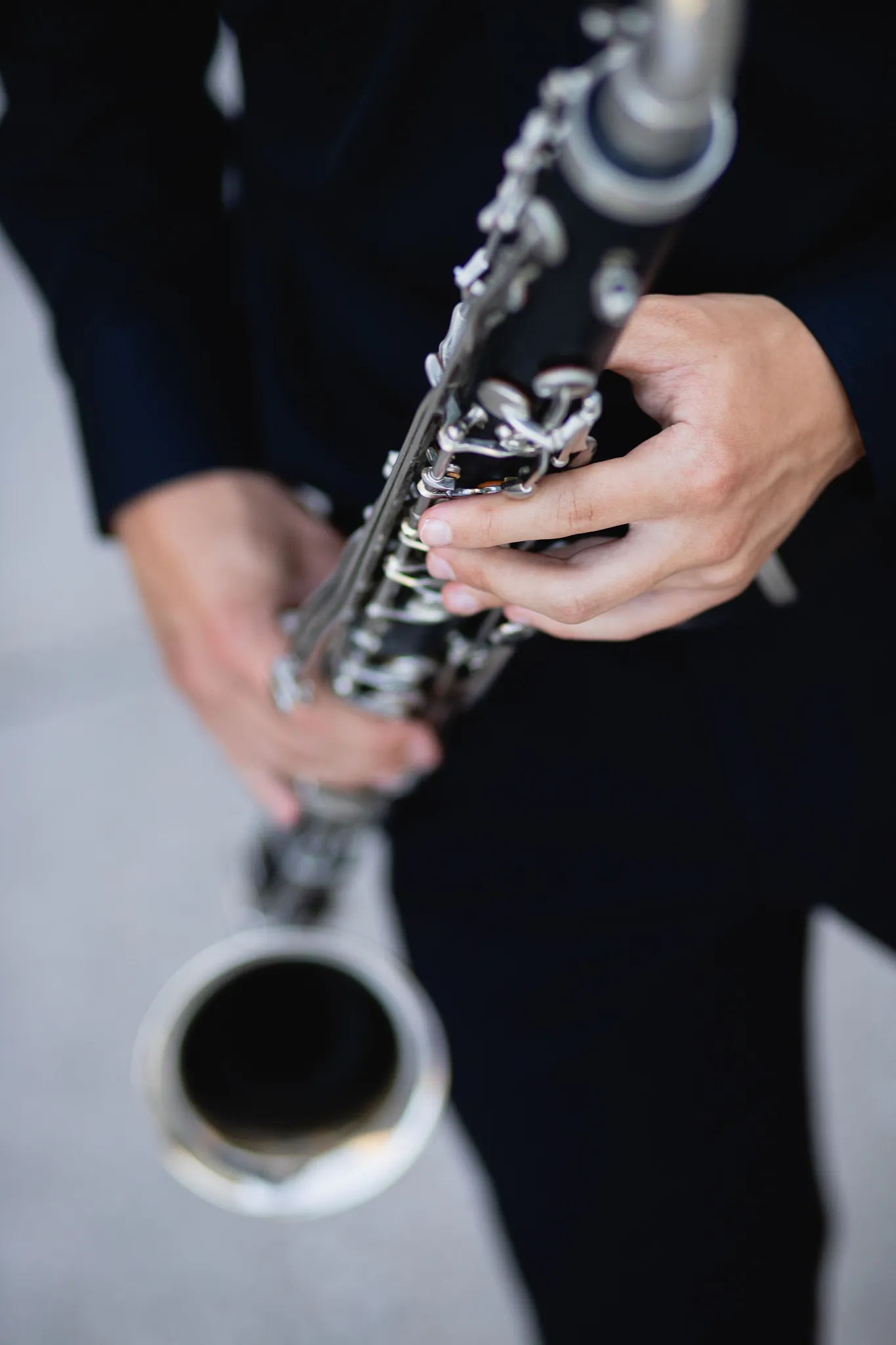 Close-up of a senior's hands holding a clarinet
